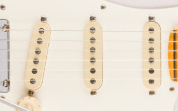American Ultra Synchronized Tremolo, cejuelas de acero inoxidable, bloque de acero laminado en frío, palanca pop-in